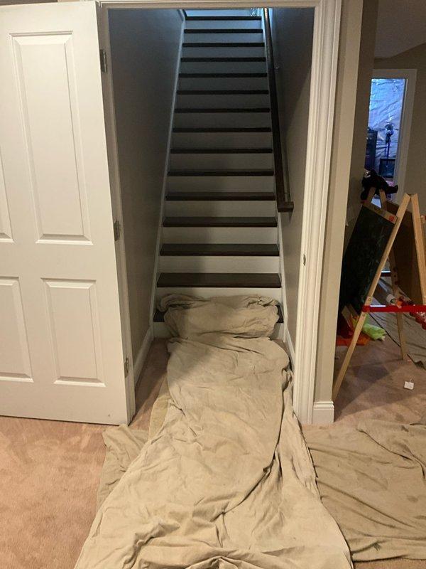Installed a new 50-gallon power vent water heater in the basement utility area, including all necessary plumbing connections with copper piping and a black expansion tank. Protected the work area with drop cloths to maintain cleanliness throughout the installation process.