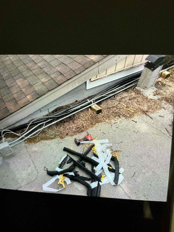 Completed installation of suction line insulation on residential HVAC system using Armorflex insulation material. Refrigerant lines were properly wrapped and secured at the outdoor condensing unit, ensuring proper thermal protection and system efficiency.