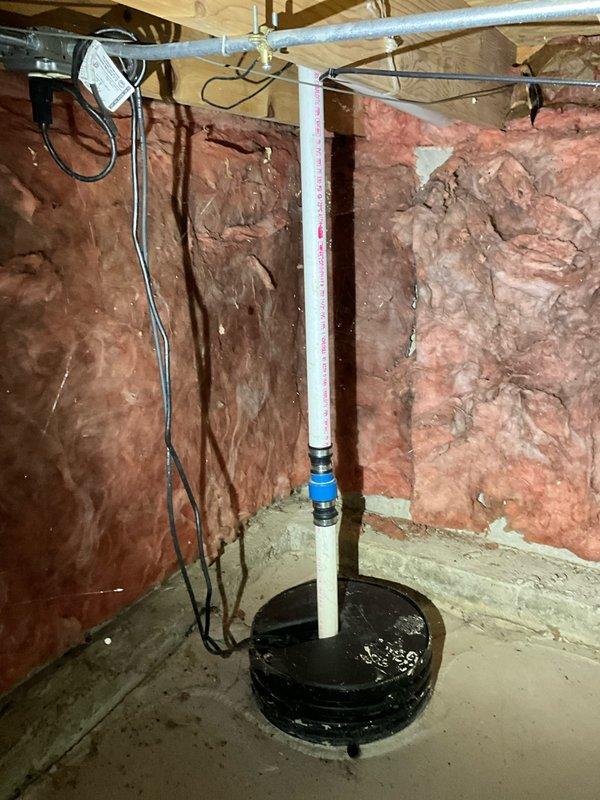 Completed comprehensive plumbing inspection as part of HVAC maintenance visit. Inspected sump pump system in basement, verifying proper operation of pump basin, discharge piping, and PVC vertical standpipe with coupling. Examined bathroom plumbing fixtures including toilet and surrounding floor area for leaks or potential issues, confirming all components functioning properly with no immediate concerns identified.