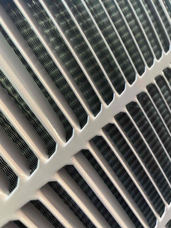 Completed comprehensive BFMA tune-up service on Bryant air conditioning system, unit age 6+ years. Performed full inspection of outdoor condensing unit including coil cleaning, checked refrigerant levels, inspected heat exchanger fins for proper airflow, verified electrical connections, and tested system operation. All components found in good working condition with no deficiencies noted; unit operating within manufacturer specifications.