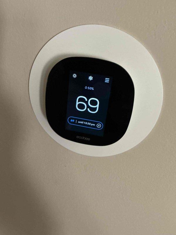 Completed comprehensive BFMA tune-up service on residential HVAC system. Performed full AC maintenance protocol including inspection of ecobee smart thermostat operation, verified proper temperature control and system response. Inspected ductwork interior and blower motor assembly, noting oxidation present on mounting components but motor functioning within normal parameters. All system components tested and operational at time of service completion.