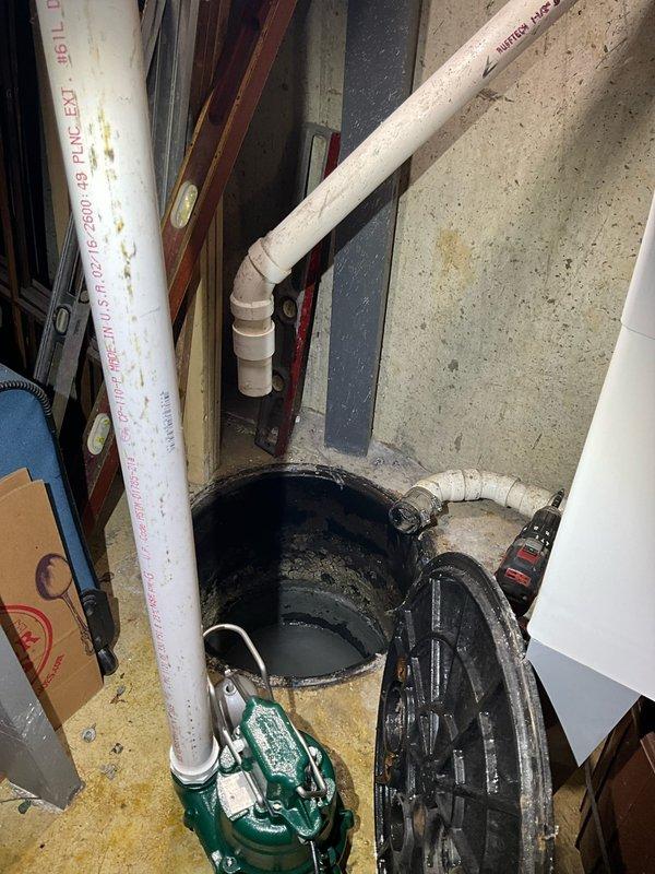 Removed and disposed of existing sump pump and check valve from basement sump pit. Installed new 1/2 horsepower Zoeller sump pump with fresh check valve, securing all PVC discharge piping with proper straps and connections. System tested and verified operational with 3-year warranty on pump and 1-year parts and labor warranty provided.