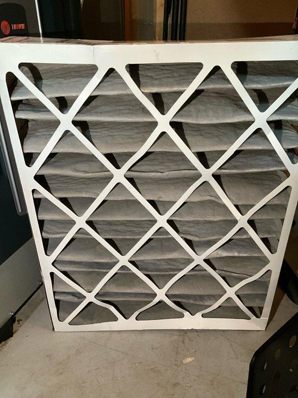 Completed comprehensive BFMA tune-up service on 14+ year old air conditioning system. Performed standard maintenance protocol including inspection of outdoor condenser unit, verified electrical connections, assessed condenser coil condition with visible debris accumulation between fins, and replaced air filter. System operational upon completion with recommendations provided for ongoing maintenance due to equipment age.