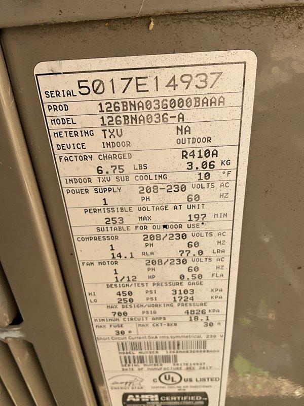Technician returned to residential property to inspect for refrigerant leak using UV dye previously injected into the system. Performed thorough examination of Bryant model 126BNA036-A air conditioning system (S/N 5017E14937) utilizing R-410A refrigerant. Conducted complete AC tune-up service including visual inspection of condenser unit, verification of electrical specifications (208-230V, 1-phase, 60Hz), and system performance evaluation. Documented equipment specifications and outdoor installation condition. No active leaks detected during dye inspection. System operating within manufacturer specifications with compressor drawing 14.1 RLA and proper refrigerant charge of 6.75 lbs maintained. All components functioning properly upon completion of service visit.