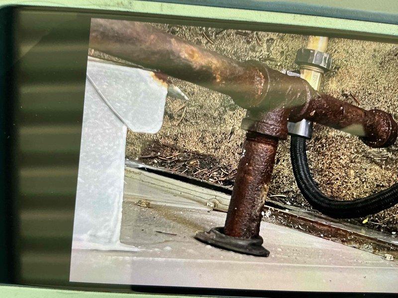 Completed comprehensive BFMA tune-up service on air conditioning system, including full system inspection and performance evaluation. Documented equipment nameplate specifications and identified significant corrosion on exterior refrigerant line set requiring future attention. System operational at time of departure with all findings photographed for service records.