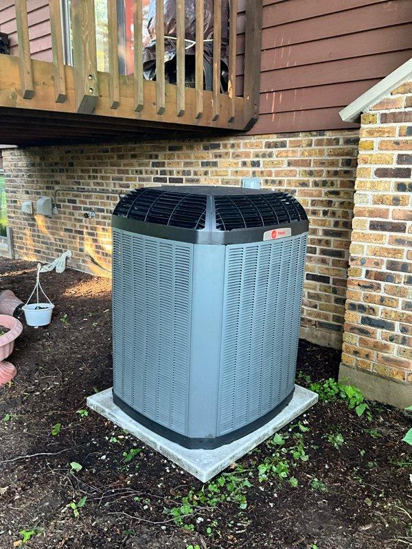 Completed comprehensive BFMA tune-up service on two outdoor air conditioning units at residential property, including full system inspection, filter replacement, and electronic air cleaner maintenance. Performed standard preventive maintenance procedures on both condenser units—a modern horizontal louvered unit and a cylindrical ribbed unit—verifying proper refrigerant levels, electrical connections, and component operation. All systems tested and confirmed operating within manufacturer specifications upon service completion.