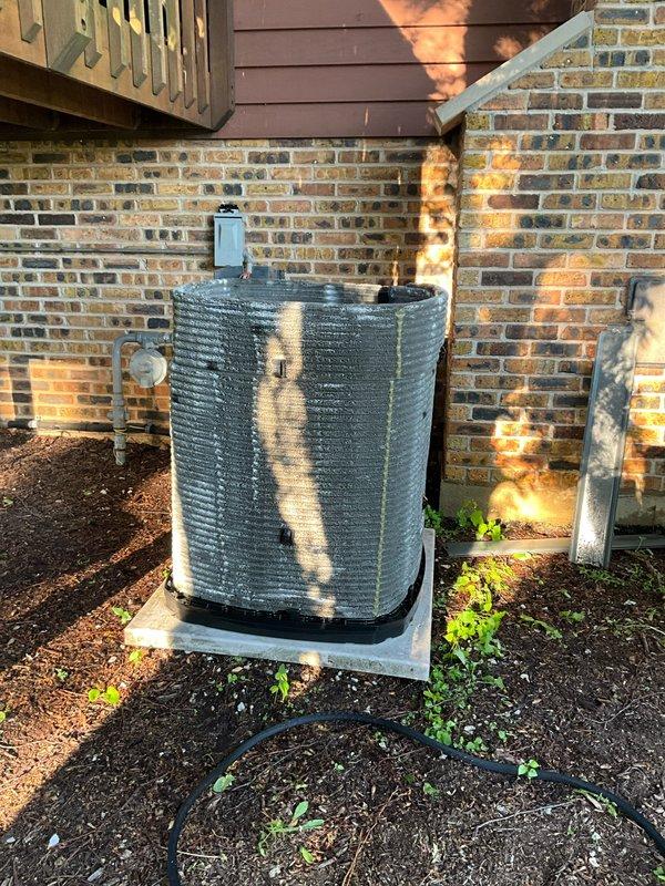 Completed comprehensive BFMA tune-up service on two outdoor air conditioning units at residential property, including full system inspection, filter replacement, and electronic air cleaner maintenance. Performed standard preventive maintenance procedures on both condenser units—a modern horizontal louvered unit and a cylindrical ribbed unit—verifying proper refrigerant levels, electrical connections, and component operation. All systems tested and confirmed operating within manufacturer specifications upon service completion.