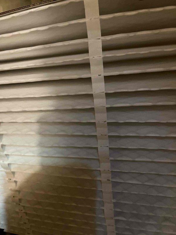 Completed comprehensive BFMA air conditioning tune-up service including full system inspection and performance evaluation. Inspected and documented air filter condition, finding pleated filter clean with no visible dust accumulation or discoloration. Examined HVAC ductwork and refrigerant line installation in attic space, noting flexible aluminum ductwork with insulation sealing and copper refrigerant lines properly routed throughout system.