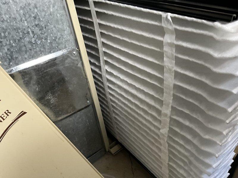 Completed comprehensive BFMA tune-up service on 14+ year old HVAC system including air conditioning unit, water heater, dehumidifier, and filter replacements. Inspected outdoor condenser unit which showed signs of dirt accumulation on coils and vegetation growth around base requiring attention for optimal airflow and efficiency. Serviced indoor HVAC components in mechanical room, performed standard maintenance procedures on all equipment, and replaced air filters to ensure proper system operation.