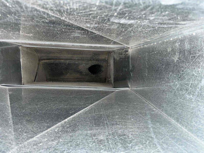 Completed comprehensive BFMA tune-up on 14-year-old air conditioning system, including full system inspection and performance verification. Measured electrical current draw at 63.3 amps AC using digital clamp meter to confirm compressor and blower motor operation within manufacturer specifications. Inspected ductwork interior, documenting dust accumulation on supply plenum surfaces for routine maintenance tracking.