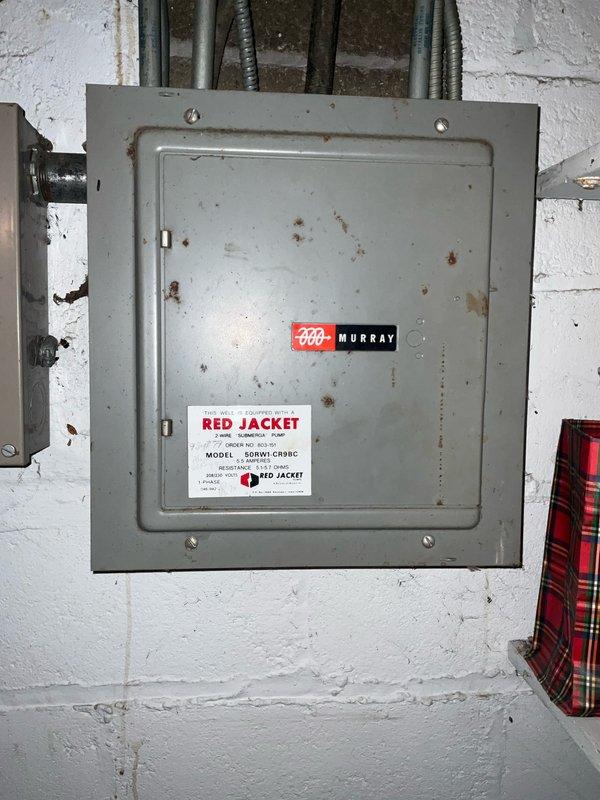Conducted comprehensive sales estimate for air conditioning and evaporator coil replacement system. Evaluated existing HVAC equipment located in basement utility area, noting significant condensation and moisture accumulation on evaporator coil assembly indicating potential efficiency issues or refrigerant concerns. Inspected electrical service panel (Murray brand) showing age-related wear and corrosion, assessed compatibility for new equipment installation. Documented existing ductwork configuration with insulated supply and return air systems, copper refrigerant lines, and PVC condensate drainage. Performed load calculation assessment and discussed equipment upgrade options with decision makers to determine appropriate tonnage and efficiency ratings for optimal home comfort and system performance.