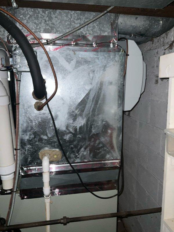 Conducted comprehensive sales estimate for air conditioning and evaporator coil replacement system. Evaluated existing HVAC equipment located in basement utility area, noting significant condensation and moisture accumulation on evaporator coil assembly indicating potential efficiency issues or refrigerant concerns. Inspected electrical service panel (Murray brand) showing age-related wear and corrosion, assessed compatibility for new equipment installation. Documented existing ductwork configuration with insulated supply and return air systems, copper refrigerant lines, and PVC condensate drainage. Performed load calculation assessment and discussed equipment upgrade options with decision makers to determine appropriate tonnage and efficiency ratings for optimal home comfort and system performance.