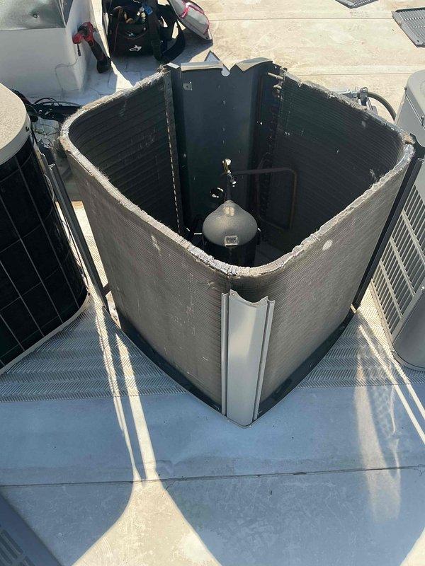 Completed comprehensive BFMA tune-up service on commercial rooftop HVAC system with equipment over 3 years old. Performed full inspection of condenser unit with housing removal to access internal components, verified proper operation of mechanical systems and electrical connections, and inspected evaporator coil assembly which showed excellent condition with clean fins and no debris accumulation. All components operating within normal parameters with indicator lights showing proper system status.