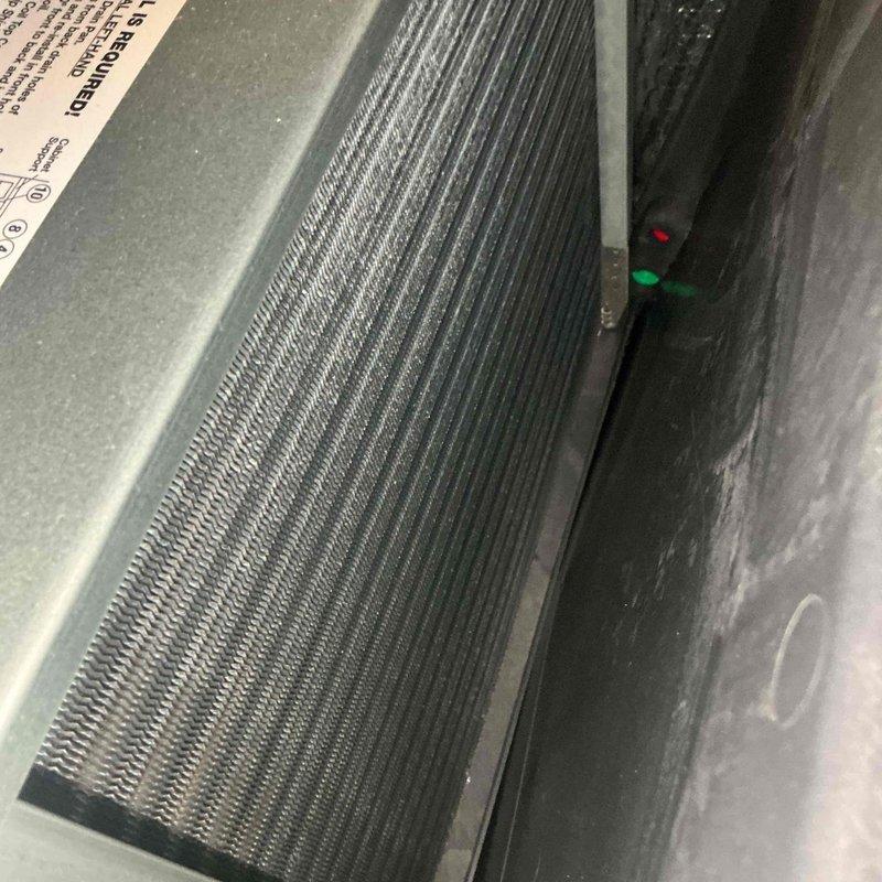 Completed comprehensive BFMA tune-up service on commercial rooftop HVAC system with equipment over 3 years old. Performed full inspection of condenser unit with housing removal to access internal components, verified proper operation of mechanical systems and electrical connections, and inspected evaporator coil assembly which showed excellent condition with clean fins and no debris accumulation. All components operating within normal parameters with indicator lights showing proper system status.