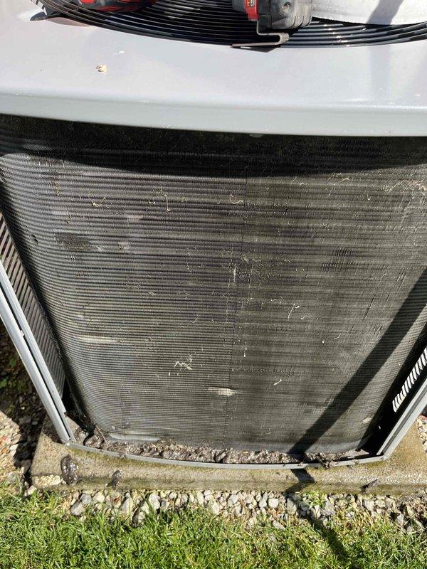 Completed comprehensive BFMA tune-up service on two Armstrong Air air conditioning systems, both approximately 4 years old. Performed thorough inspection of both outdoor condenser units, noting significant accumulation of dirt, dust, and debris throughout the condenser coil fins on one unit that required cleaning to restore optimal heat exchange efficiency. Conducted standard maintenance protocol including system performance testing, electrical connection verification, and refrigerant line inspection to ensure proper operation of both units for the cooling season.
