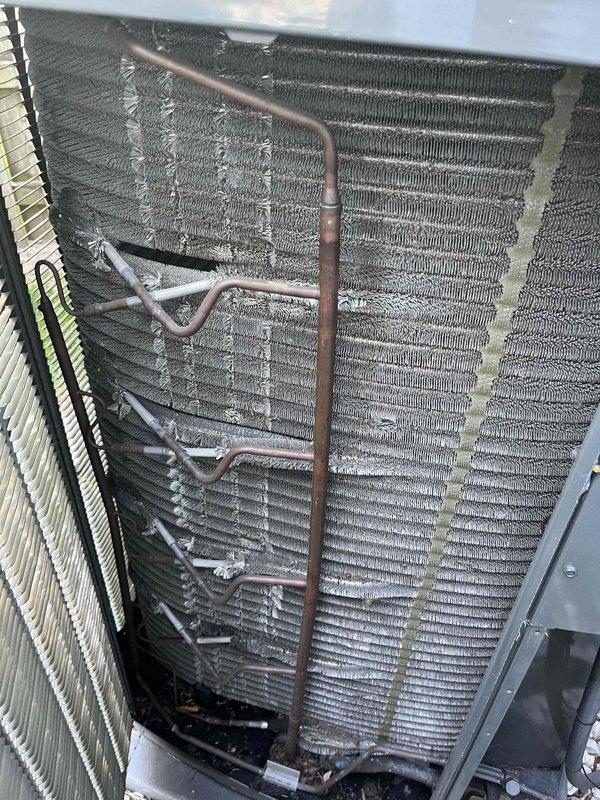 Completed comprehensive BFMA tune-up service on residential air conditioning system aged 3+ years. Performed thorough inspection of outdoor condenser unit and indoor evaporator coil assembly, noting dust and debris accumulation on coil fins requiring attention. Conducted standard maintenance procedures including cleaning coil surfaces, inspecting refrigerant lines for proper connections and oxidation, verifying system components, and ensuring unit operational readiness for continued efficient performance.