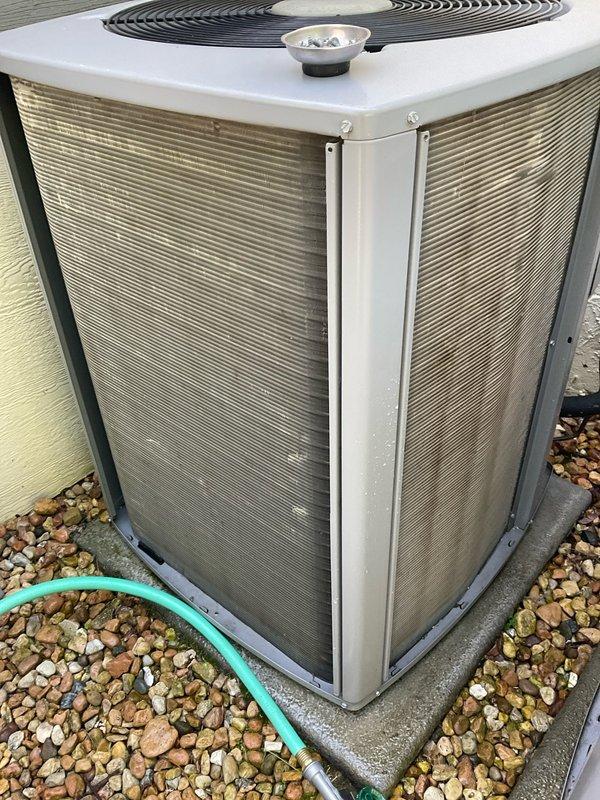 Completed comprehensive BFMA air conditioning tune-up on outdoor condenser unit. Performed standard maintenance protocol including system inspection, cleaning of condenser coils and exterior grilles, verification of proper refrigerant levels, and testing of all electrical components. Addressed thermostat firmware issues by updating system software and correcting time/date settings to restore proper programming functionality.