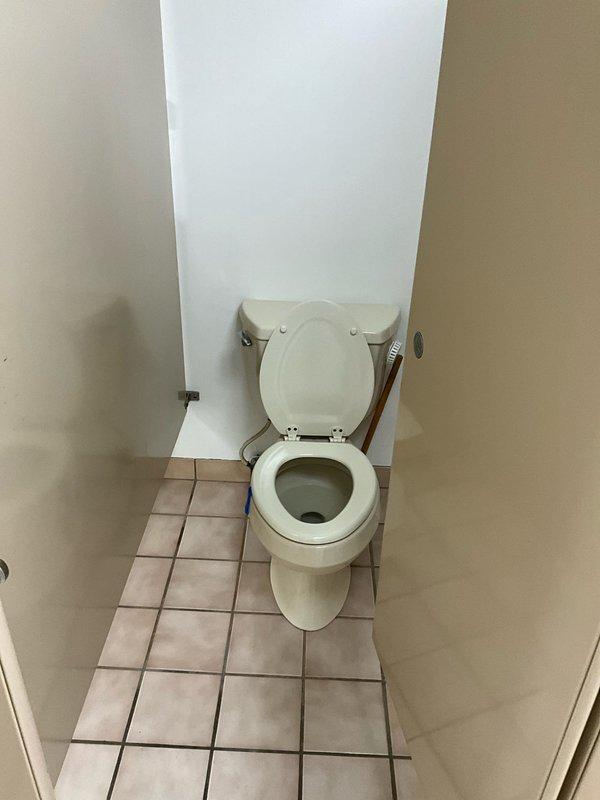 Responded to service call for toilet emitting foul odors in commercial restroom facility. Upon arrival, performed visual inspection of toilet fixture and surrounding drainage system. Based on previous service history indicating temporary improvement from rodding, conducted thorough drain line assessment to identify source of recurring odor issues.

Utilized drain auger to clear potential blockages in the toilet drain and branch line that may have been contributing to sewer gas escape. Verified proper water seal level in toilet trap to ensure adequate barrier against odor penetration. Inspected wax ring seal at toilet base and flange connection for any compromise that could allow sewer gases to enter the restroom space. All connections appeared intact with no visible signs of leakage or seal failure.

Tested drainage flow and flushing performance to confirm adequate water movement through the system. Drainage operated within normal parameters following rodding procedure. Documented cond