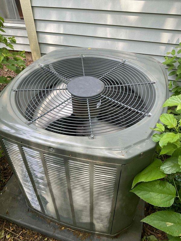 Performed comprehensive BFMA tune-up on 7+ year old residential air conditioning system. Completed full system inspection, replaced air filter, and assessed condenser unit which exhibited significant cabinet deterioration with corroded outer casing panels and exposed internal coil assembly. Noted vegetation encroachment around unit and debris accumulation on condenser fins requiring attention for optimal airflow and system efficiency.