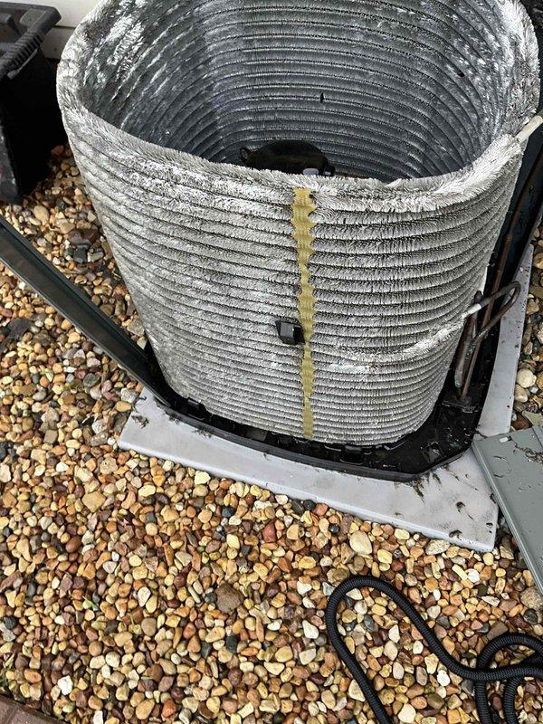 Completed comprehensive BFMA tune-up service on outdoor air conditioning unit aged 10+ years. Inspected condenser coil showing significant dust accumulation, mineral deposits, and minor algae growth on exterior surfaces; noted weathering consistent with unit age. Performed standard maintenance procedures including system inspection, measurement documentation, and photographic record of equipment condition for service history.