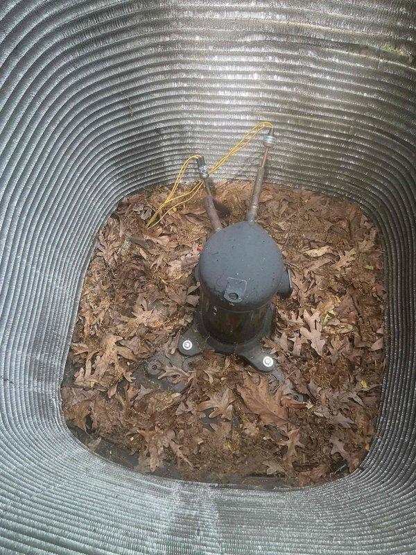 Completed comprehensive BFMA tune-up service on residential air conditioning system with equipment aged 1-3 years. Performed full inspection and maintenance of outdoor condenser unit, which showed significant organic debris accumulation including pollen, algae buildup on lower fin sections, and dried leaves within the unit housing. Cleaned condenser coils and fins to restore proper airflow and heat transfer efficiency, removed all organic debris from unit interior and surrounding base area, and verified proper operation of all system components. Unit restored to optimal operating condition with improved airflow and heat exchange capabilities.