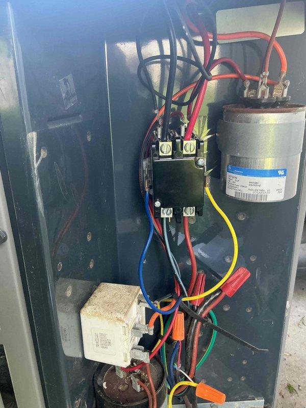 Responded to no cooling call where thermostat indicated cooling mode but system was not producing cold air. Upon inspection of electrical control panel, diagnosed failed capacitor preventing compressor operation. Replaced defective capacitor, verified proper electrical connections at contactor and all wire terminals, tested system operation, and confirmed unit now cooling properly with all components functioning within normal parameters.
