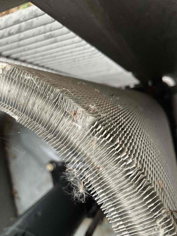 Completed comprehensive BFMA tune-up on residential air conditioning system. Inspected evaporator coil and found moderate dust and lint accumulation between fins; cleaned coil to restore proper airflow and heat transfer efficiency. Inspected outdoor condenser unit, verified aluminum finned coils were in clean operating condition, checked electrical connections and capacitor, and confirmed all components functioning within normal parameters.