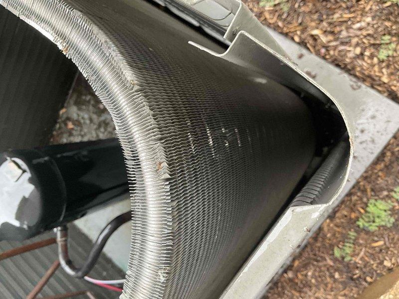 Completed comprehensive BFMA tune-up on residential air conditioning system. Inspected evaporator coil and found moderate dust and lint accumulation between fins; cleaned coil to restore proper airflow and heat transfer efficiency. Inspected outdoor condenser unit, verified aluminum finned coils were in clean operating condition, checked electrical connections and capacitor, and confirmed all components functioning within normal parameters.