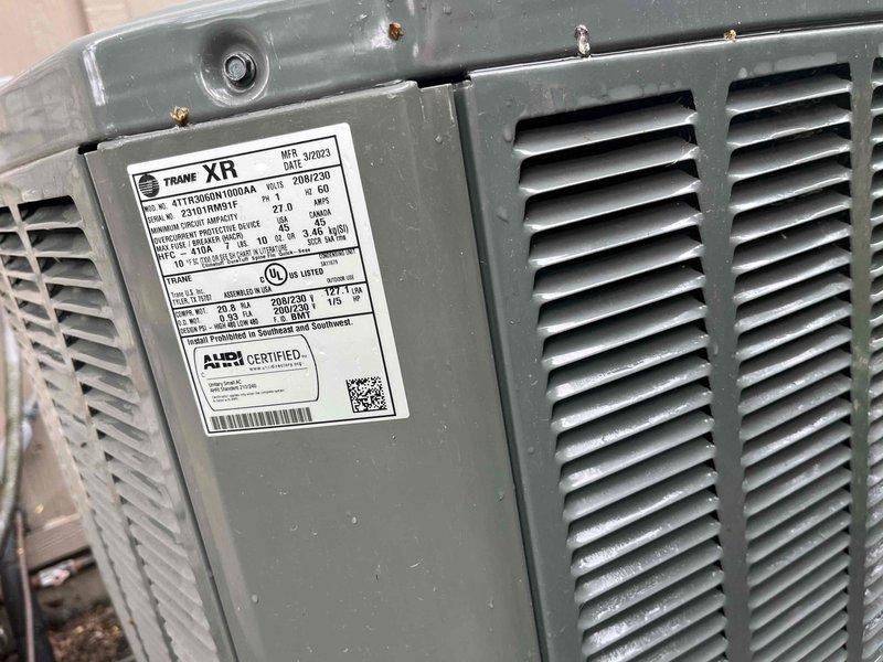 Completed comprehensive BFMA tune-up on 2-year-old Trane XR model 4TTD0060H1000AA air conditioning condenser unit. Performed full system inspection, cleaned evaporator coils, checked refrigerant lines and connections, verified electrical components and capacitor operation, and cleared debris including vegetation growth from condensate drain pan. Unit tested and operating within manufacturer specifications upon completion.