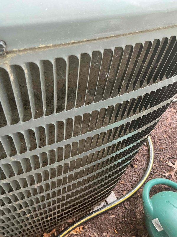 Completed comprehensive air conditioning tune-up on residential split system of unknown age. Performed standard preventive maintenance including inspection of indoor furnace blower assembly, electrical connections, and control board components. Inspected outdoor condenser unit, noting moderate dirt and debris accumulation in coil fins that will require monitoring for optimal heat transfer efficiency.