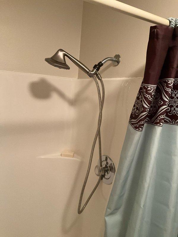 Completed comprehensive plumbing inspection as part of BFMA tune-up service during afternoon appointment window. Inspected bathroom plumbing fixtures including sink, faucet, drain assembly, and shower system with handheld spray unit and chrome control valve. All fixtures found to be in proper working order with no leaks, drainage issues, or visible concerns identified at time of inspection.