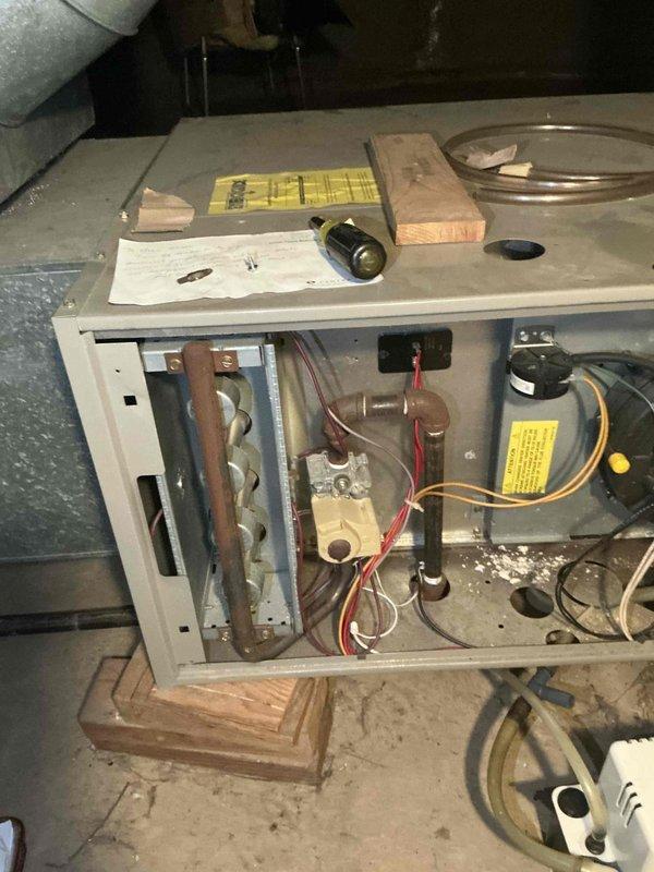 Responded to service call for 15+ year old air conditioning system failure that occurred over the weekend. Upon inspection, evaluated existing HVAC system including furnace and evaporator coil configuration in basement mechanical room. Provided comprehensive estimate for complete A/C system and evaporator coil replacement, offering cost-effective alternative to previous high-priced proposal from competing contractor. Documented existing equipment condition and installation specifications through detailed site photography for accurate system sizing and replacement planning.