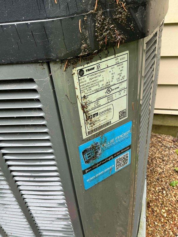 Completed comprehensive BFMA tune-up on 2-year-old Trane XR outdoor condensing unit. Performed electrical diagnostics using digital multimeter, verified proper voltage readings at control connections, inspected and tested all wire terminations with appropriate wire nut connections. Cleaned accumulated debris, pine needles, and organic growth from unit top and exterior surfaces to ensure proper airflow and prevent premature corrosion.