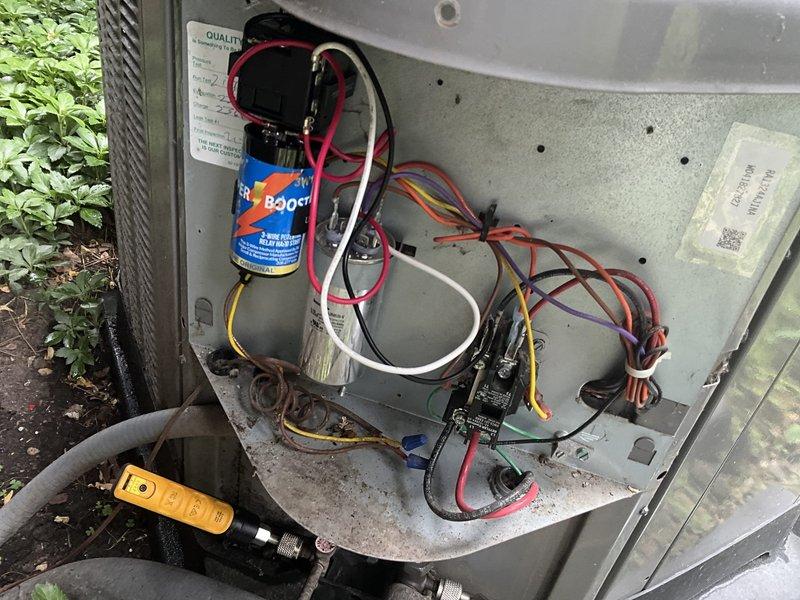 Responded to no cooling call at residential property. Upon arrival, verified system was not operating. Inspected electrical panel and confirmed power supply to unit. Proceeded to outdoor condensing unit and removed access panel for diagnostic evaluation. Located blue dual-run capacitor and performed electrical testing using multimeter to check capacitance values and voltage. Found capacitor had failed and was preventing compressor and condenser fan motor from starting. Replaced defective capacitor with properly rated replacement unit. Reconnected all electrical terminals, verified proper wire connections, and secured access panel. Cycled system on at thermostat and confirmed compressor and outdoor fan motor started successfully. System now cooling properly and operating within normal parameters.