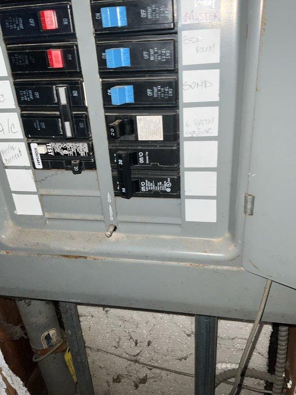 Conducted comprehensive sales estimate for complete air conditioning and evaporator coil replacement system. Evaluated existing HVAC equipment located in basement utility area, including current furnace installation and associated electrical service panel. Assessed electrical panel capacity and circuit breaker configuration to ensure adequate power supply for proposed new A/C system. Inspected existing plumbing connections, condensate drainage lines, and refrigerant piping infrastructure to determine compatibility with replacement equipment. Documented current system layout including furnace positioning, ductwork connections, and utility access points to provide accurate equipment sizing and installation specifications for proposed upgrade.