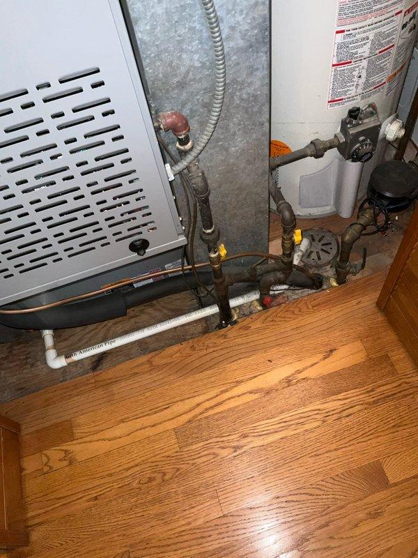 Conducted comprehensive sales estimate for complete air conditioning and evaporator coil replacement system. Evaluated existing HVAC equipment located in basement utility area, including current furnace installation and associated electrical service panel. Assessed electrical panel capacity and circuit breaker configuration to ensure adequate power supply for proposed new A/C system. Inspected existing plumbing connections, condensate drainage lines, and refrigerant piping infrastructure to determine compatibility with replacement equipment. Documented current system layout including furnace positioning, ductwork connections, and utility access points to provide accurate equipment sizing and installation specifications for proposed upgrade.