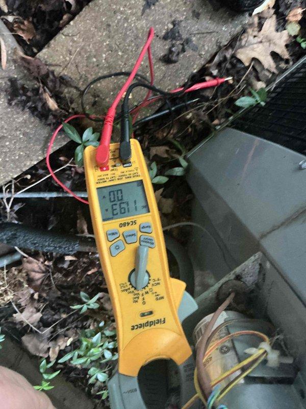 Completed comprehensive BFMA tune-up service on residential air conditioning system over 3 years old as first appointment of the day. Performed standard AC maintenance protocol including electrical diagnostics with multimeter, which displayed readings during outdoor condenser unit testing. Inspected heat exchanger coil assembly, noting clean fin condition with proper spacing and no significant debris accumulation, indicating good airflow capacity. All components assessed and system operational parameters verified per manufacturer specifications.