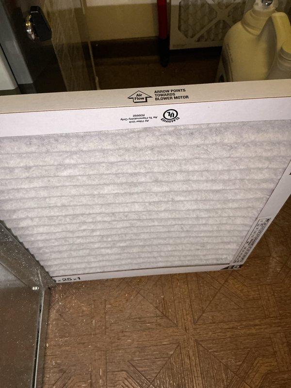 Completed comprehensive BFMA tune-up service on residential air conditioning system over 3 years old during afternoon appointment window. Performed full system inspection of outdoor condenser unit, noting accumulated debris and dirt on exterior fins requiring attention. Replaced air filter with new unit, verified proper airflow direction marking, and inspected indoor components including blower motor assembly. Cleaned condenser coils, checked refrigerant lines and electrical connections at disconnect box, and confirmed unit operational status on concrete pad foundation.