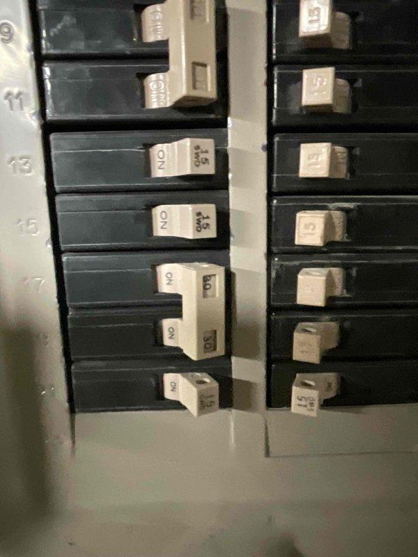 Conducted sales estimate for air conditioning system replacement on property with multiple HVAC units. Customer requested evaluation and proposal for replacing aging AC unit. Documented existing electrical service panel and circuit breaker configuration to assess compatibility with new equipment installation requirements.