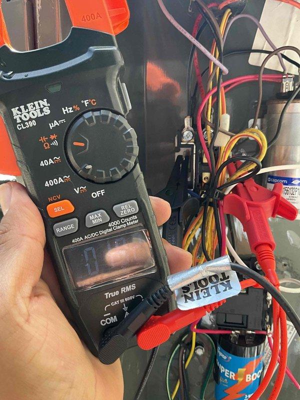 Responded to residential no cooling call where outdoor condensing unit was not operating despite thermostat calling for cooling with indoor temperature at 82°F and setpoint at 70°F. Performed electrical diagnostics using digital clamp meter at condensing unit to check voltage and amperage at compressor and contactor. Inspected electrical connections, terminal block, and wiring configuration including capacitor connections and control wiring. Identified and resolved electrical issue preventing compressor operation, restoring normal cooling function to system.