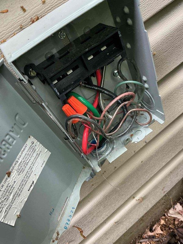 Responded to no cooling complaint where client reported blower operation but no cool air and inability to achieve temperatures below 77 degrees. Upon arrival, performed diagnostic testing using clamp meter to measure electrical parameters at the outdoor unit, revealing insufficient amperage draw indicating compressor failure to engage. Inspected electrical disconnect box and found loose wiring connections with disorganized wire management that had compromised system operation. Secured all electrical connections, verified proper voltage supply, and restored unit to normal cooling operation with compressor running at proper amperage.