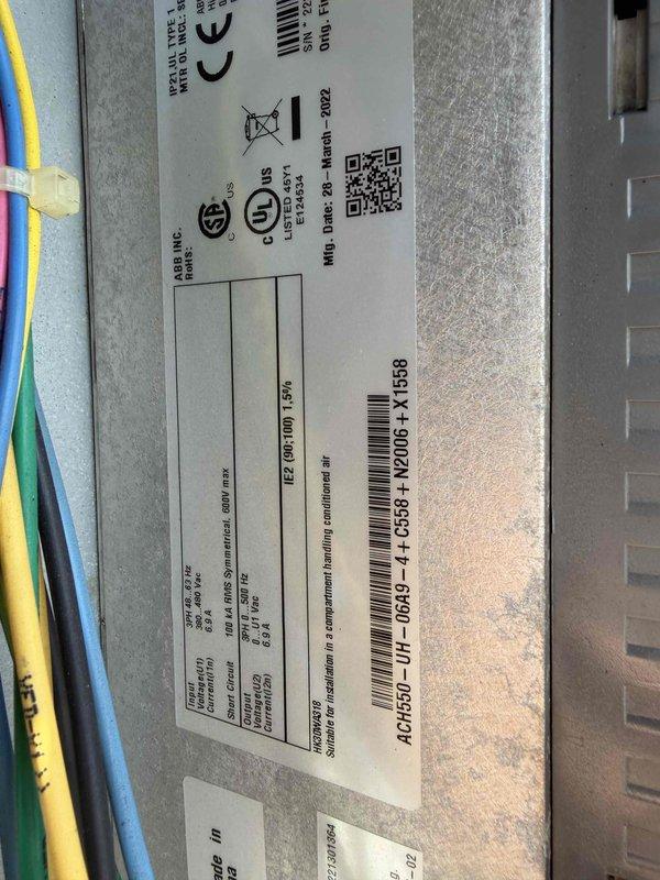 Responded to after-hours no cooling call for rooftop unit that experienced unusual noise before failure. Upon arrival, inspected RTU electrical components and control systems. Verified power supply at breaker panel and confirmed unit was receiving proper voltage. Diagnosed failed variable frequency drive (VFD) based on manufacturer label inspection showing 2022 manufacturing date and system error indicators. Replaced defective VFD unit and restored full cooling operation to commercial facility.