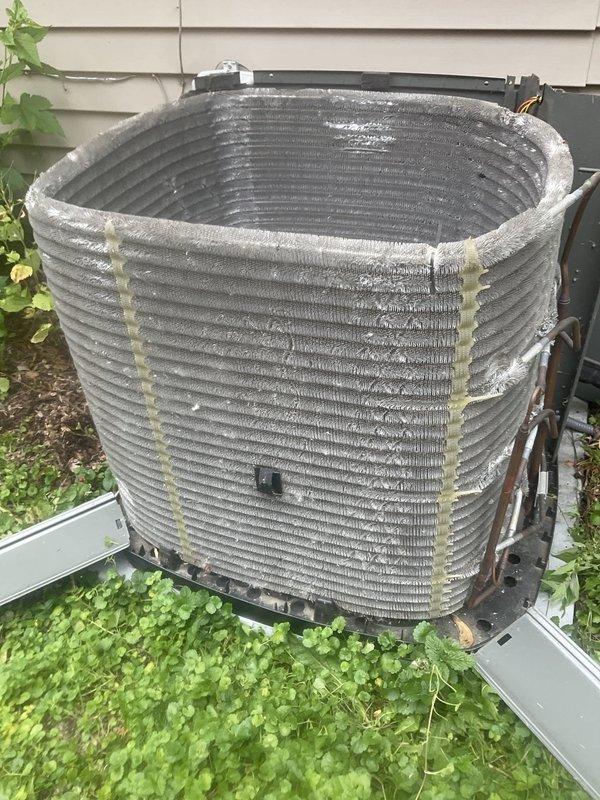 Completed comprehensive BFMA tune-up service on residential air conditioning system aged 3+ years. Performed standard maintenance protocol including inspection of outdoor condenser unit, which showed typical weathering and debris accumulation on coil fins consistent with outdoor exposure. Cleaned condenser coils to remove dirt, grime, and vegetation debris that had accumulated on horizontal ribbed fins and metal surfaces. Verified proper clearance around unit and addressed vegetation encroachment around base and sides of equipment. Inspected electrical disconnect, mounting hardware, and refrigerant lines for proper operation. System operating within normal parameters upon completion of tune-up service.