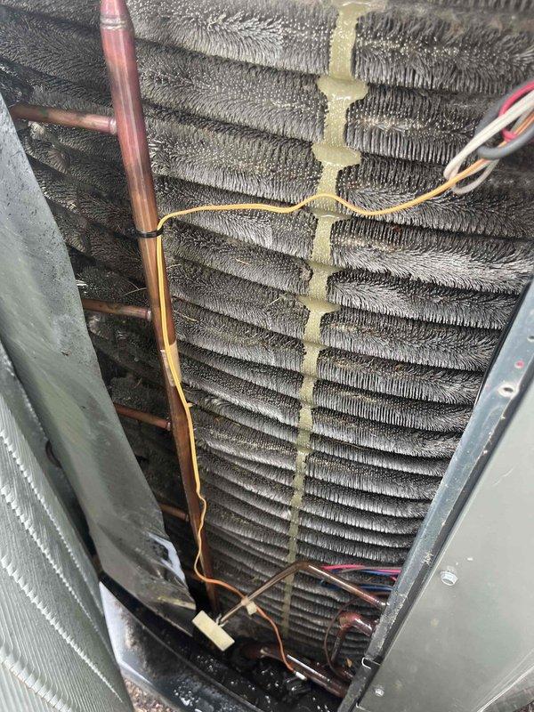 Completed comprehensive BFMA tune-up service on a 5+ year old Trane air conditioning unit during afternoon appointment window. Performed full system inspection, cleaned condenser coils which showed moderate dust and debris accumulation between fins, checked refrigerant levels and copper line connections, verified electrical connections and wiring integrity, and tested overall system operation. Unit is functioning properly with all components operating within normal parameters.