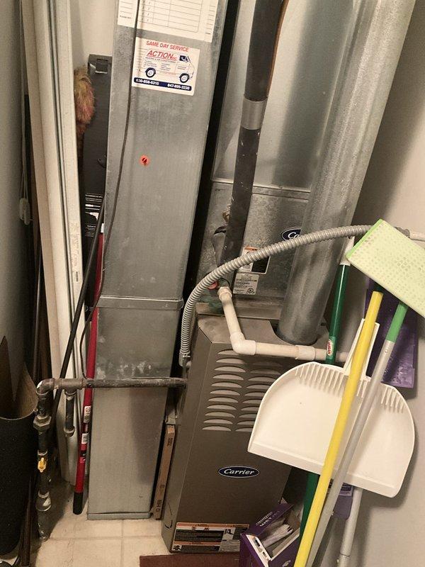Conducted comprehensive sales estimate for air conditioning system and evaporator coil replacement at residential property. Evaluated existing HVAC installation including vertical air handler unit and Carrier furnace/AC unit located in interior utility closet. Assessed electrical service panel to verify adequate circuit capacity and breaker configuration for proposed equipment upgrade. Documented refrigerant line routing, condensate drainage system, and existing equipment specifications. Photographed current system configuration showing air handler with associated copper refrigerant lines, utility connections, and integrated Carrier equipment to develop accurate replacement proposal matching home's comfort requirements and spatial constraints.