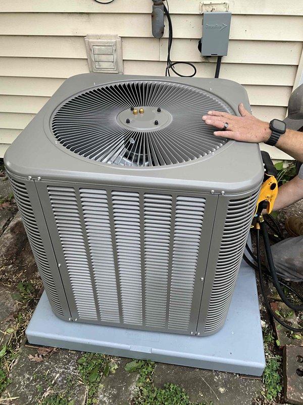 Completed full HVAC system installation consisting of a 3-ton ML13KC1-030 air conditioning condenser unit paired with a CK40HT-36B evaporator coil and an EL297UH070XV36BK 70,000 BTU 97% AFUE two-stage variable-speed furnace. Installed furnace in horizontal configuration within crawl space with proper clearances and venting, routing supply and return ductwork along ceiling joists with appropriate insulation and support strapping. Positioned outdoor condenser unit on concrete pad with proper clearances from structure, installed 30-amp fusible disconnect box with two 25-amp fuses, and ran refrigerant lines and electrical conduit to exterior wall penetration. Completed secondary refrigerant line run through horizontal crawl space as specified. Installed AA210 condensate management system and programmed 4235 thermostat for two-stage heating and cooling operation. Verified all electrical connections meet code requirements, tested system startup and operation, confirmed proper airflow and ref