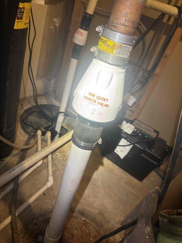 Replaced defective TXV metering device in cooling system under manufacturer's warranty and installed a Quiet Check Valve on the sump pump discharge line. System pressures were verified using calibrated manifold gauges, confirming proper refrigerant charge and operational parameters post-repair.