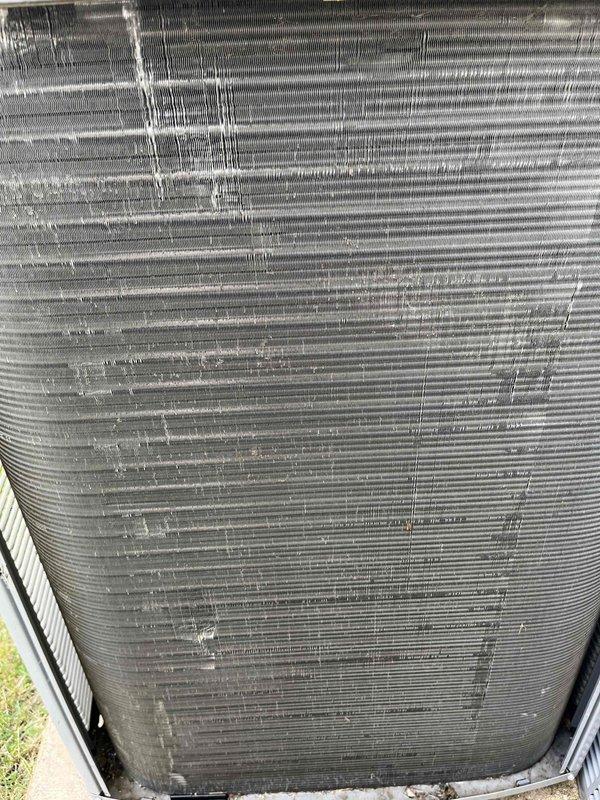 Completed comprehensive BFMA preventive maintenance tune-up on residential outdoor air conditioning condenser unit. Performed standard inspection of all major components including heat exchanger coil array, condenser fan assembly, electrical connections, and refrigerant lines. Documented equipment condition with photographic records showing aluminum fin coil assembly with minor dust accumulation typical for outdoor installation, verified unit operational status, and confirmed proper placement on concrete pad with adequate clearance from structure.