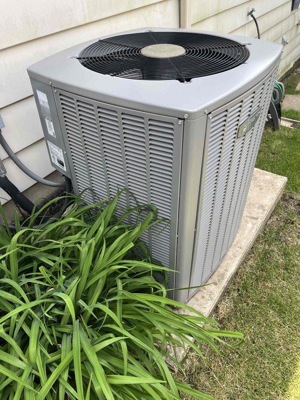 Completed comprehensive BFMA preventive maintenance tune-up on residential outdoor air conditioning condenser unit. Performed standard inspection of all major components including heat exchanger coil array, condenser fan assembly, electrical connections, and refrigerant lines. Documented equipment condition with photographic records showing aluminum fin coil assembly with minor dust accumulation typical for outdoor installation, verified unit operational status, and confirmed proper placement on concrete pad with adequate clearance from structure.