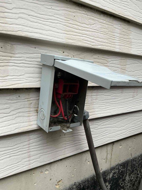 Responded to no cooling call at residential property. Upon arrival, verified system was not cooling and instructed client to turn unit off or run fan only to prevent further damage. Inspected outdoor condensing unit and electrical disconnect box. Documented existing conditions including visible staining on building exterior and foundation near equipment location for service records.